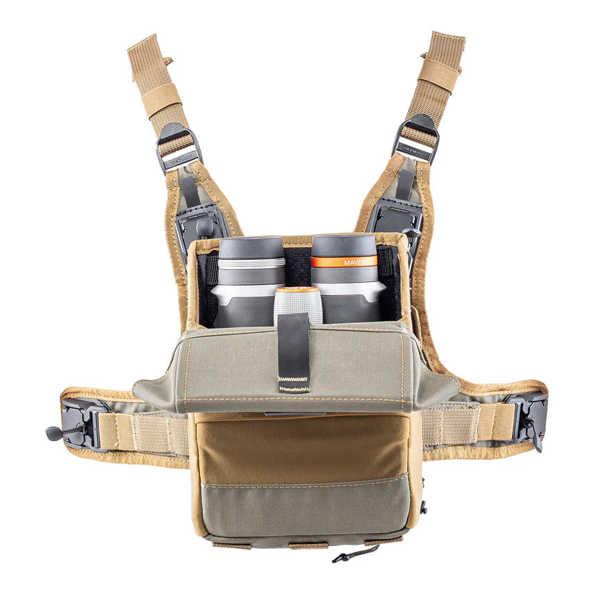 Tan binocular harness with multiple pockets and straps, and a pair of maven binoculars sticking out on a white background