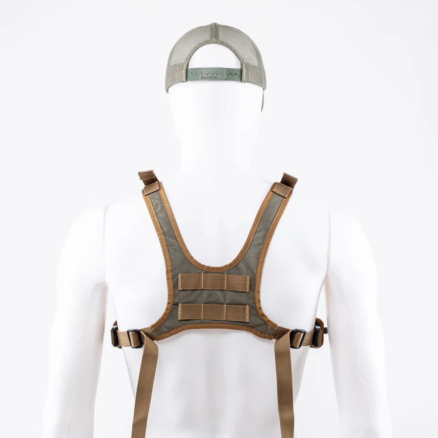 Brown quick release tactical harness and cap on a white mannequin