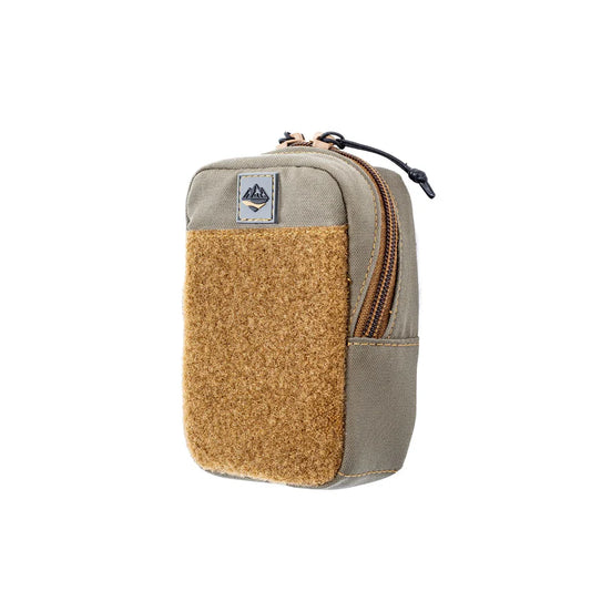 Small pouch with cork texture and zipper on a white background